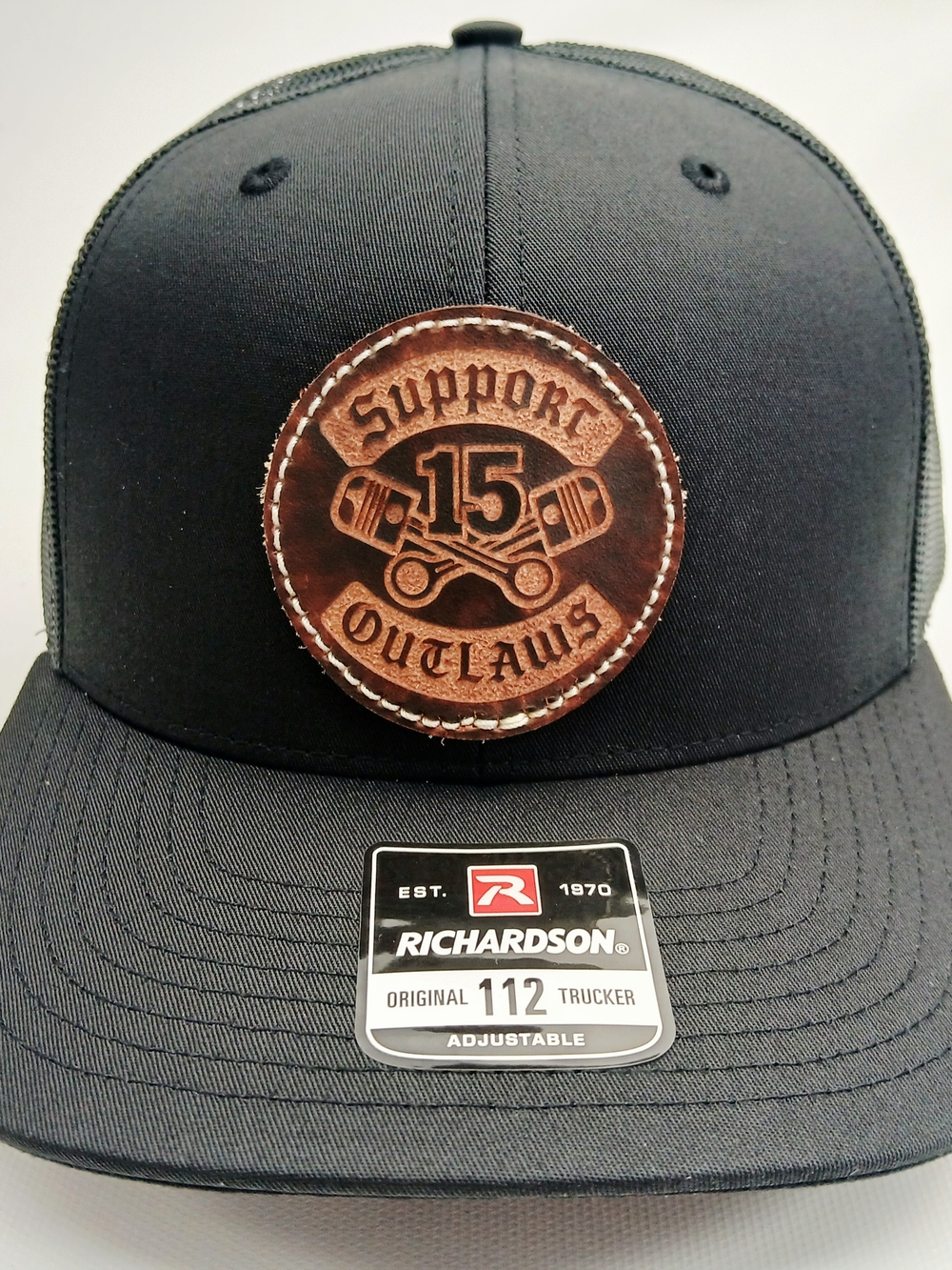 Richardson Black Trucker Hat with Brown Leather Patch - Support 15 Outlaws